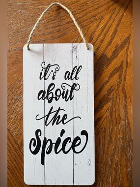 White "It's All About the Spice" Hanging Wall Sign